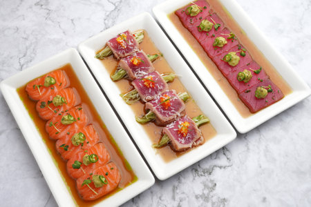 Tuna appetizer with soy sauce. Japanese tiradito tuna, salmon. Restaurant menu food