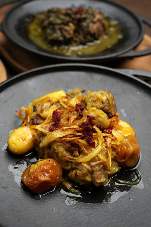 Pilaf with set of sauces and baked vegetables served on tableの写真素材