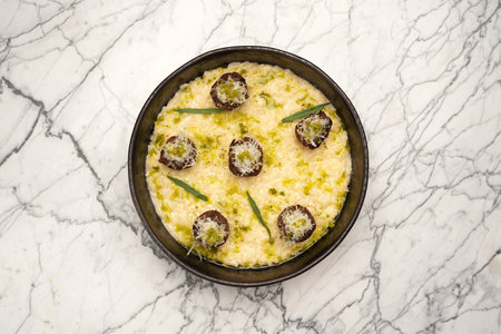 Italian meatballs with cheese sauce in frying pan.の写真素材