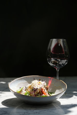 Veal salad with vegetables and teriyaki. Sliced meat and vegetables salad in a white bowlの写真素材