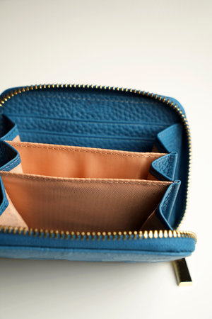 Empty wallet on a white background, close-up, verticalの写真素材