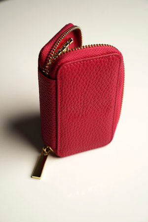 Leather key holder on a gray background, close-up