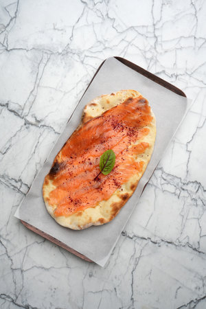 Smoked salmon on pita bread, top viewの写真素材