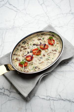 Mushroom sauce with champignons, beef, tomato and creamの写真素材
