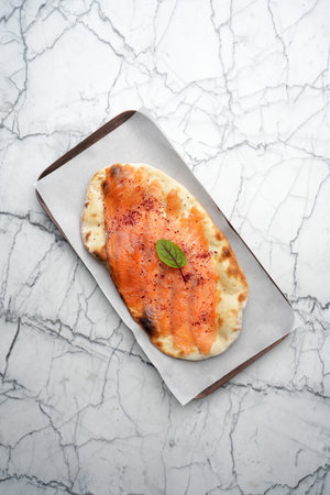 Smoked salmon on pita bread, top viewの写真素材