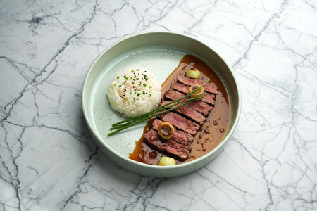 Wagyu Beef Sukiyaki and Rice on marble table background with copy space, close-up. Japanese food menuの写真素材