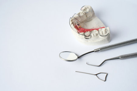 Dental Plate for Children, Retainer for teeth correction. Dental braces, orthodontic bite treatment.の写真素材