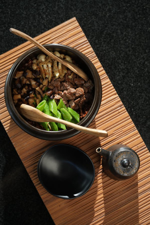 Beef with vegetables in a bowl on a bamboo matの写真素材