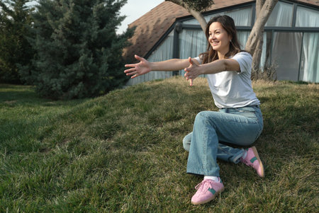 Playful Game Between Mother and Child Outdoors. A woman and her young daughter are playing a game of...