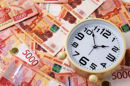 Time is Money Concept with Clock and Russian Ruble Money Currencyの写真素材