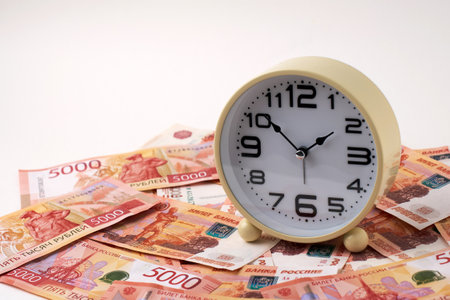 Time is Money Concept with Clock and Russian Ruble Money Currencyの写真素材