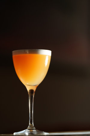 Classic cocktail glass in a nightclub restaurant, close-upの写真素材