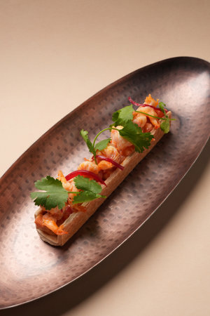 Gourmet appetizer featuring shrimp and red onion in a crisp shell, garnished with coriander, served...