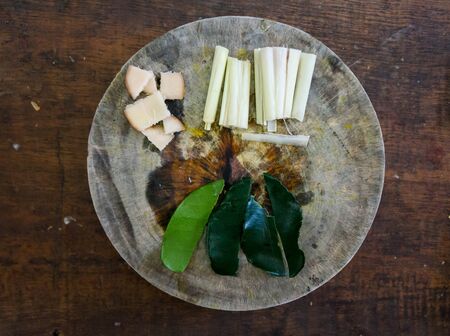 Incredients for thai coconut soup on a wooden cutting board.の写真素材