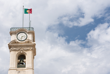 The Portuguese flag is flying above the Tower of the University of Coimbra in Portugal