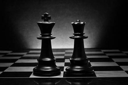 Chess. Black King and Queen on the board .The most powerful figures. Set of chess figures.の写真素材