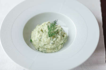 Mashed potatoes with dill in big white plateの写真素材
