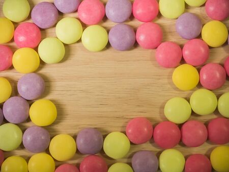 colorful Sweet Candy on wood plateの写真素材