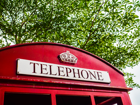 Traditional British red telephone box close-up.の写真素材