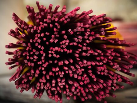 closeup bottom of Red Incense sticksの写真素材