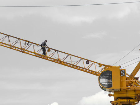 crane worker walking on steel crane, thailand