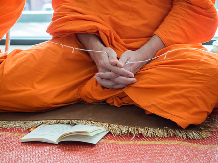 Thai Buddhist Monk Praying Hands Ritual Prayer ,Read the prayerの写真素材
