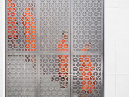 Buddhist monks walking down stair behind screen partitionの写真素材