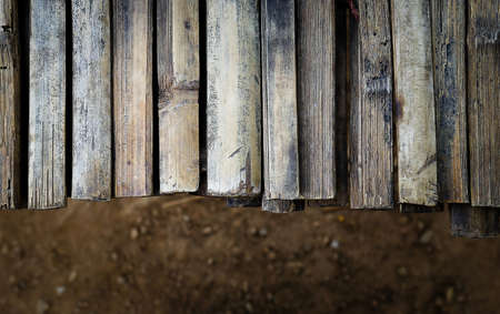 wooden desk and dark floorの写真素材