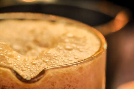 thai ice tea with milk in glassの写真素材