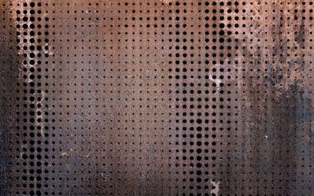 The vintag rusty grunge steel decorated by drilling a wall textured background