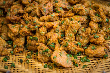 Spicy fried fish cake (Tod Mun Pla) served with cucumber and sweet sauce. street food in Thailand. with vintage filterの写真素材