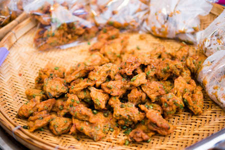 Spicy fried fish cake (Tod Mun Pla) served with cucumber and sweet sauce. street food in Thailand.の写真素材