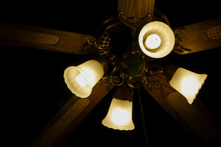 Ceiling fan with lights. Decorative ventilation with lamps on the ceiling. soft focus.の写真素材
