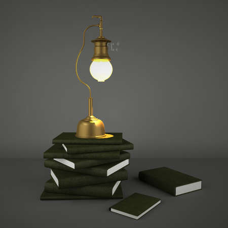 Vintage brass metal gas lamp and pile of booksの写真素材