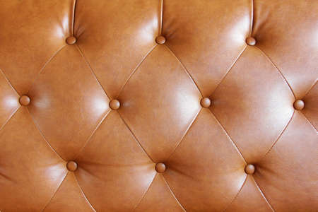 Brown leather sofa texture background with detailsの写真素材
