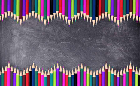Wave colored pencils on blackboard for backgroundの写真素材
