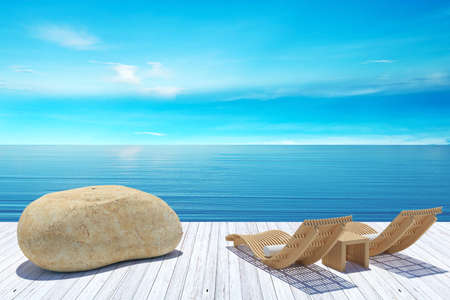 Beach lounge, sundeck over blue sea and sky, summer beach holiday vacation conceptの写真素材