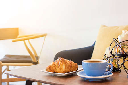 Croissant and coffee for breakfastの写真素材