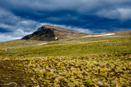 Dark clouds gather above a summit of the Dientes del Navarino. This is the view you get when climbing Cerro Bandera near Puerto Williams, a town on Navarino Island in the extreme south of Chile.のeditorial素材