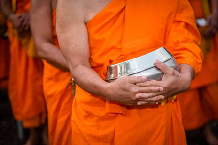 BUDDHIST MONKS : Thai Monks walking in the morning for Receive Food , Thailand.の写真素材