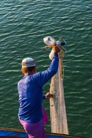 Muslim Fisherman Fishing Nets,Andaman Sea off the coast, Ranong Southern Thailandの写真素材