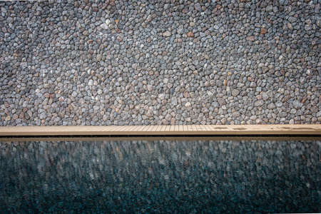 Swimming pool and stone Wallの写真素材