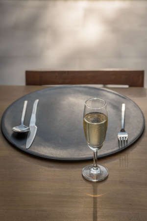 Spoon,Fork, Knife and wine glass on the tableの写真素材