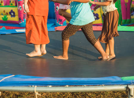 jumping on a trampoline, Thai kidsの写真素材