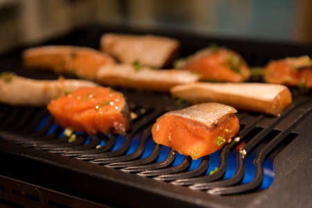 Grilled salmon on the flaming grill.の写真素材