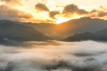 Morning fog and the beautiful sun light in a landscapeの写真素材