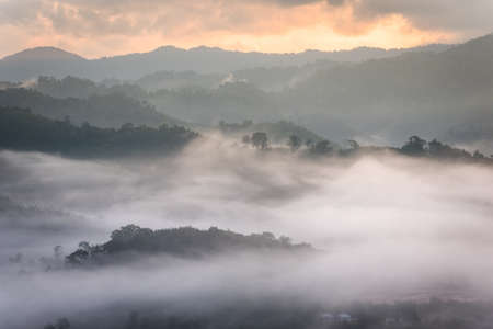 Morning fog and the beautiful sun light in a landscapeの写真素材