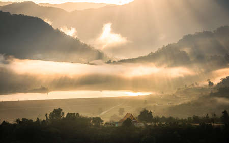 Morning fog and the beautiful sun light in a landscapeの写真素材