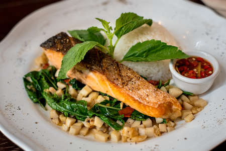 Thai fusion food,Fried salmon and stir fried mushroom and basil with rice and fish sauce chilliの写真素材
