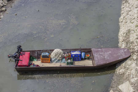 Small fishing boat with fishing gear, top viewの写真素材